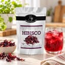 Chá de Hibisco Karpinski 50 g — ao lado de chá servido em copo