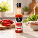 Molho de Pimenta Jalapeño Vermelha Karpinski 60 ml — na bancada da cozinha
